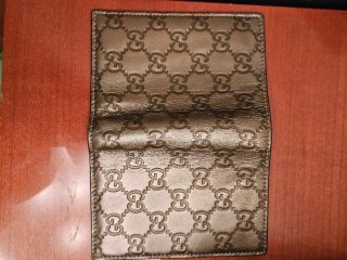 Portafoglio Gucci monogramma oro