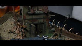 Diorama militar con figura y bidones