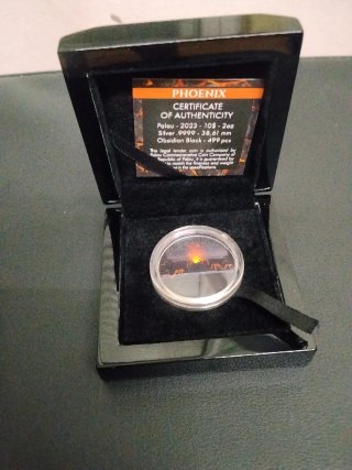 Moneda coleccionable ave fénix