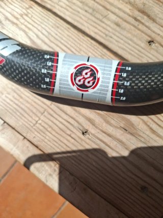 Manillar MEREK Carbon 64.5cm 31.8mm Doble Altura