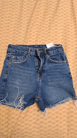 Shorts di jeans blu strappati