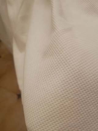 Vestidura Ropa de cuna de pique y bordado blanco.