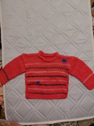 Jersey niña rosa con detalles azules