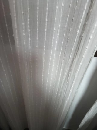 Cortinas grises y visillo blanco