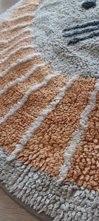 Alfombra infantil de tela con diseño de león.