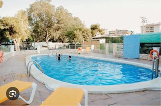Caravana fija en camping
