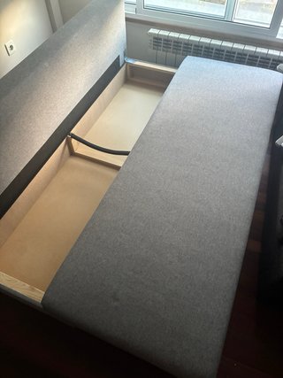 Sofá cama gris de tela