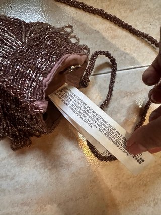 Bolso Zara de pedrería lila brillante