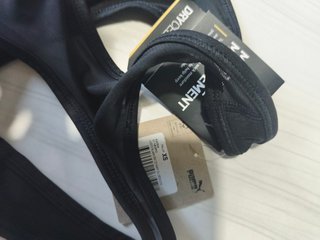 Top deportivo Puma negro mujer