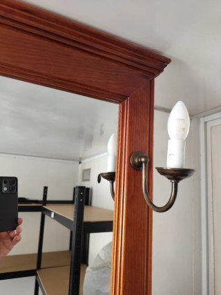 Espejo de madera con apliques color bronce