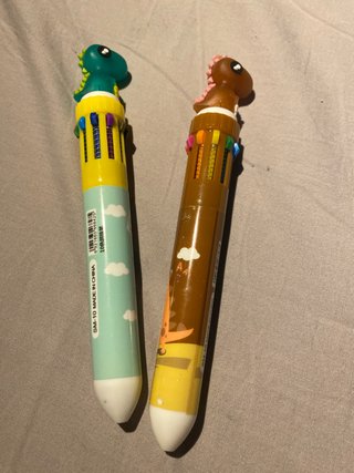 Bolígrafos de dinosaurio multicolor