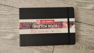 Caja libros, cuadernos dibujo, acuarela y lápices