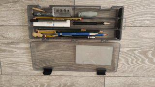 Caja libros, cuadernos dibujo, acuarela y lápices
