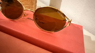 Gafas de sol Miu Miu ovaladas doradas 1.1