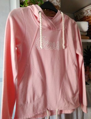 Sudadera rosa con capucha y bolsillos Clockhouse