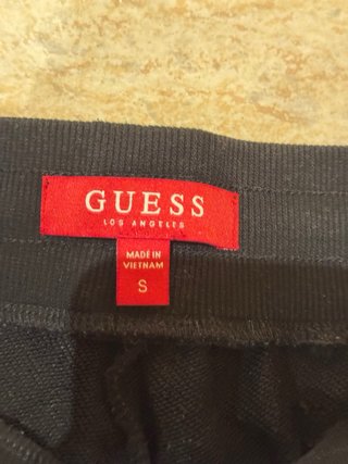 Pantalones Guess negros con logo lateral