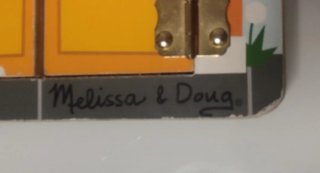 Tablero de Pestillos Montessori de Melissa & Doug