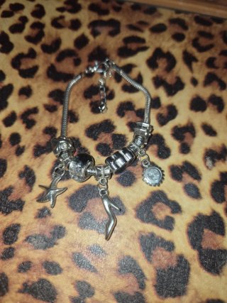 Pulsera de acero con charms