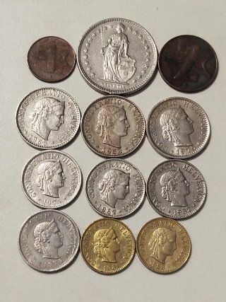Lote de 12 monedas Suizas.
