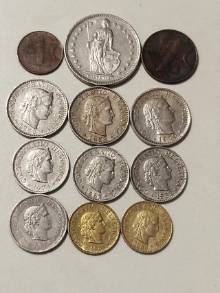 Lote de 12 monedas Suizas.