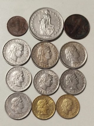 Lote de 12 monedas Suizas.