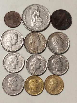 Lote de 12 monedas Suizas.