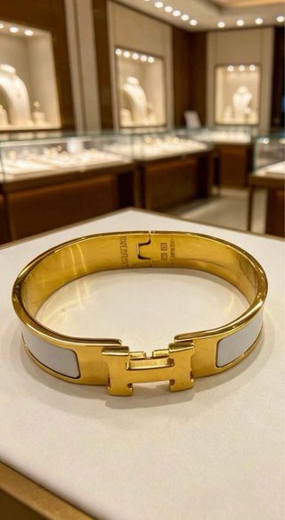 Pulsera Hermès H Dorada y Blanca