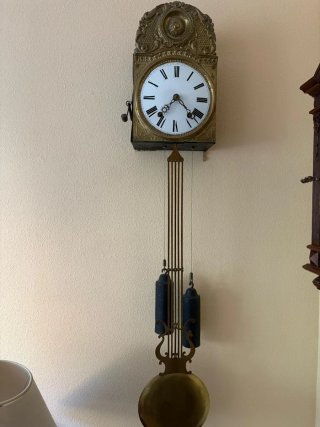 Reloj de pared antiguo dorado
