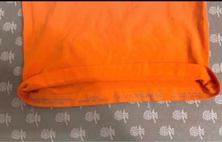 Top smanicato collo alto arancione