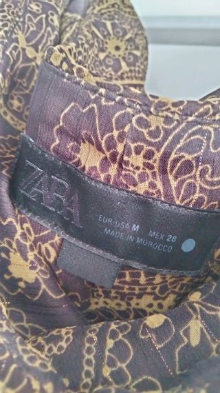 Falda larga estampada marrón e hilo dorado