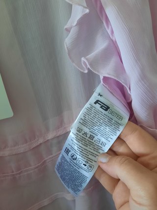 Blusa rosa manga larga con volantes