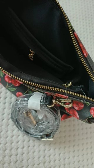 Bolso reversible y neceser Desigual