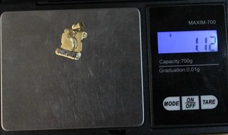 Colgante de oro combinado de 18k. Peso: 1.12 gr.