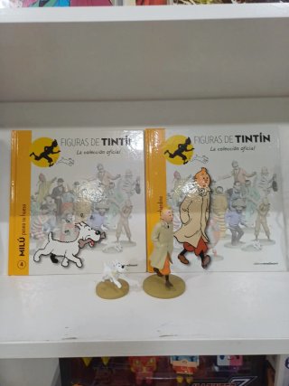 Figuras Tintín y Milú con libro y pasaporte