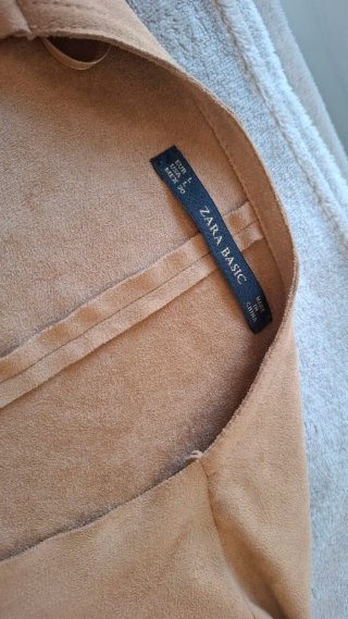 Chaqueta marrón con flecos
