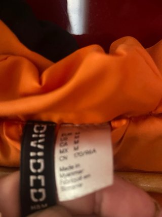 Plumas largo mujer negro/naranja oversize