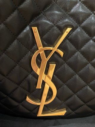 Bolso Saint Laurent piel negro y dorado