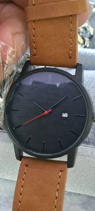Orologio da polso nero con cinturino marrone