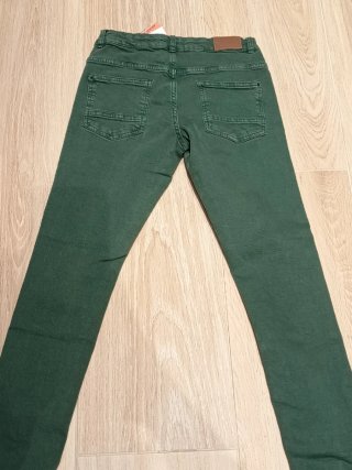 Vaquero elástico verde Corte Inglés T.11-12