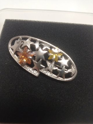Broche estrellas circonitas naranja y plata