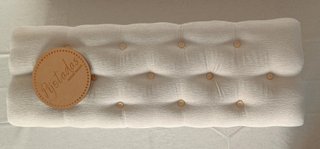 Banqueta tapizada beige