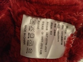 Manta sofá/cama rojo. poliéster