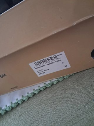 Anfibio Michael Kors nero con dettagli oro