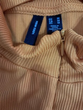 Blusa sin mangas con cremallera