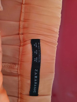 Pantalón naranja tiro bajo caído