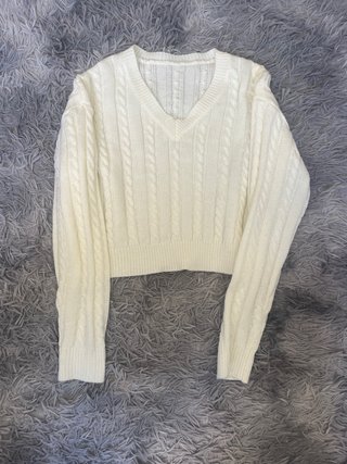 Jersey de punto cuello pico trenzado