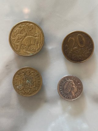 Lote 4 monedas antiguas: Dólar, Peseta, Leke, Libr