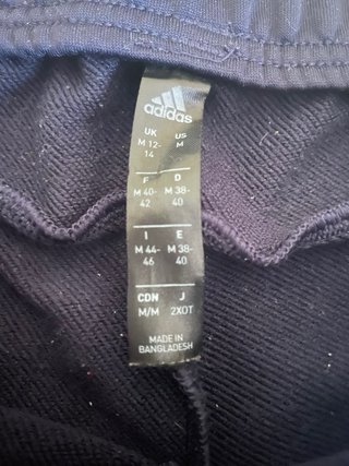 Pantaloni tuta Adidas neri con bande verdi