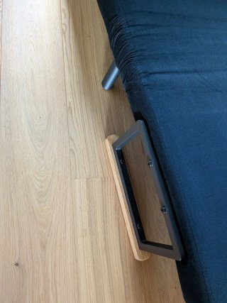 Sillón cama negro con cojín