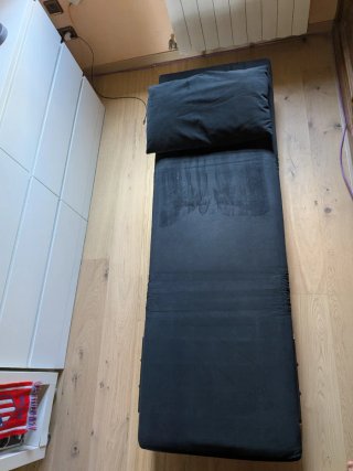 Sillón cama negro con cojín
